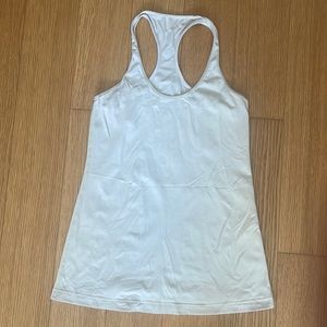 Lulelemon pale yellow racerback tank top “nulu” material